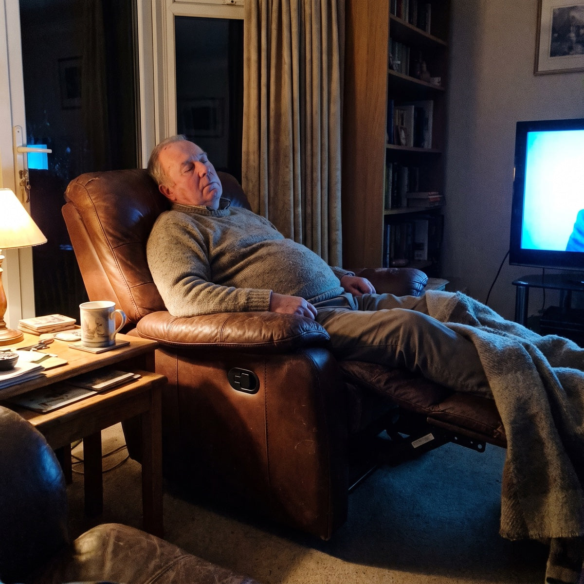 Man asleep in his recliner in the evening
