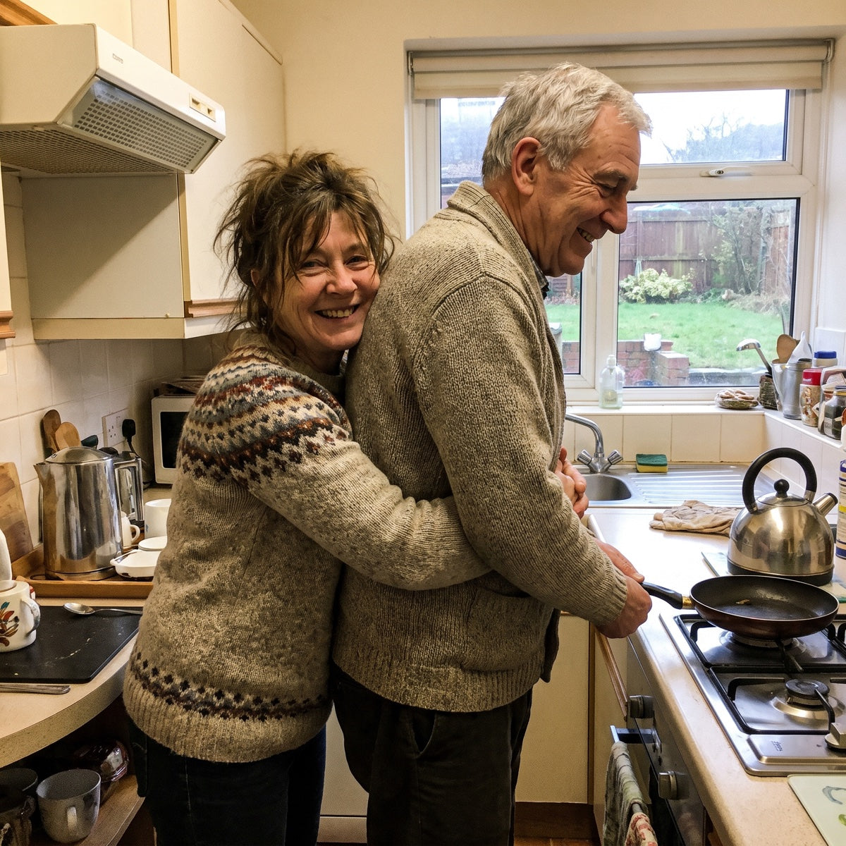 Wife hugging her husband from the front in the kitchen