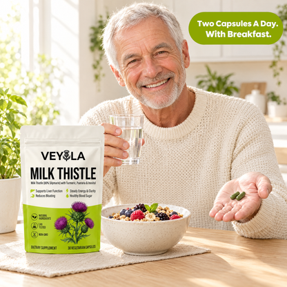 Man taking two Veyola capsules with breakfast